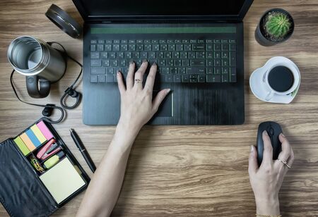 worker laptops Network Digital Technology and People using different devices at coffee cup tableの写真素材