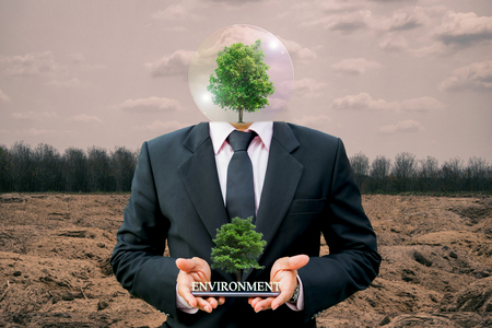 Ecology concept human hands holding big plant tree with on world environment dayの写真素材