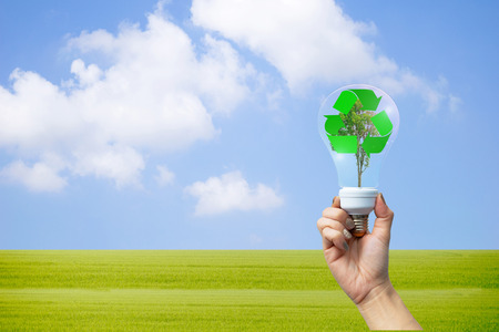 recyclable environment human hands holding light bulb withの写真素材