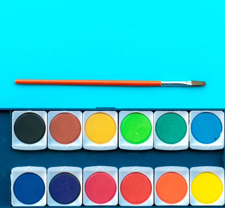 Watercolor and paintbrush put on the table of paint artworkの写真素材