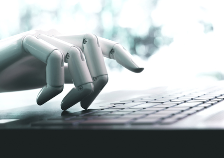 Robot concept or robot hand chatbot pressing computer keyboard enterの写真素材