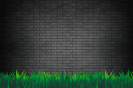 Brick wall and grass background or wallpaperの写真素材