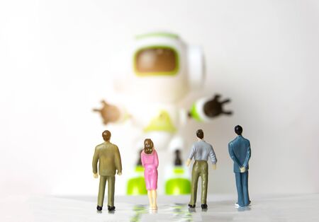The little person businessman small stand to see robot technologyの写真素材