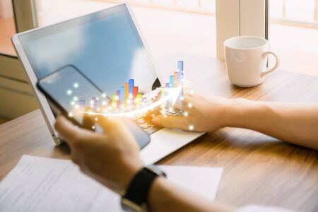business graph and arrow concept development to success growing annual revenue growthの写真素材