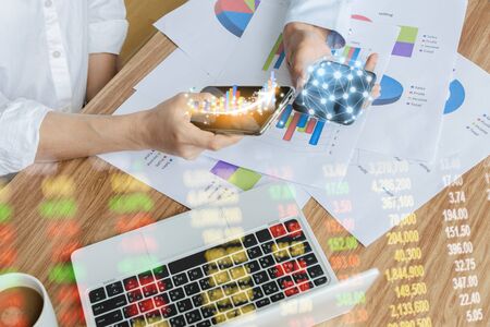 Business team work analyzing charts network technology world the desk notebook on wood table Idea...