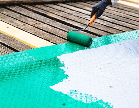 Painted with a roller on the steel floorの写真素材
