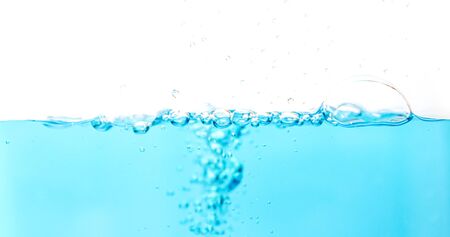 Water splash with bubbles of air blue water wave fefreshing abstract backgroundの写真素材