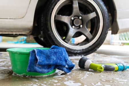 wash a car fabric and bubbles to clean the carの写真素材