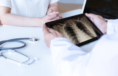 The doctor examined the patient and looked at the x-ray for the tablet.