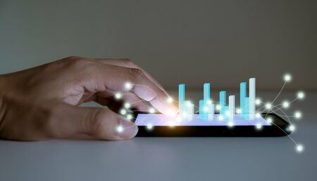 Business analyze graphs with the technology development pointing graph corporate to success and...