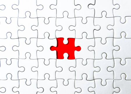 Fill the missing parts fragment of white jigsaw concept puzzle for succeedの写真素材