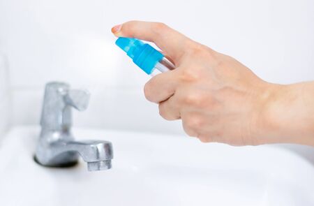 Alcohol spray water tap clean protection against Coronavirus 2019 (Covid-19)の写真素材