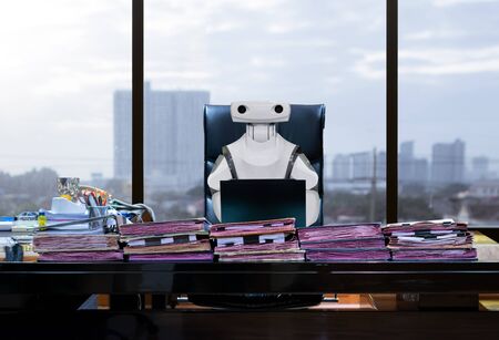 Robots work for humans office business RPA Robotic Process Automationの写真素材