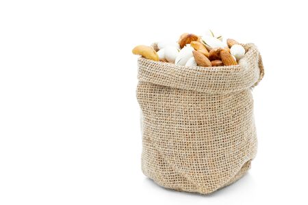 Almonds Pistachio and  Cashews in a sack on a white backgroundの写真素材