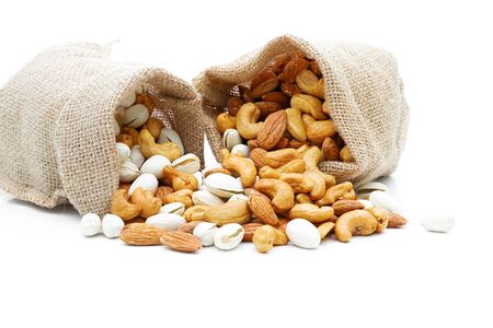  Almonds Pistachio and  Cashews in a sack on a white backgroundの写真素材