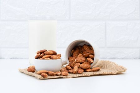 Milk Almonds in a glass on a white backgroundの写真素材