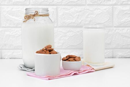 Milk Almonds in a glass on a white backgroundの写真素材