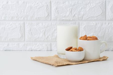 Milk Almonds in a glass on a white backgroundの写真素材