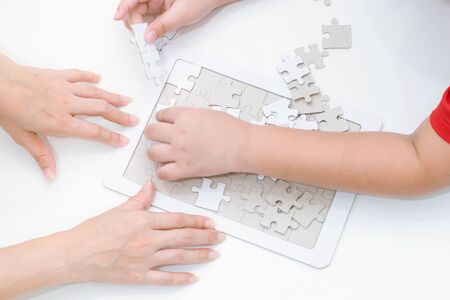 Adults and children development to jigsaw the skills, ideas, abilitiesの写真素材