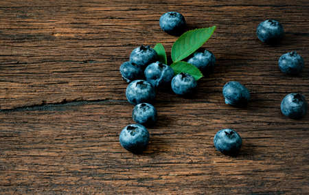 Blueberry fruit on the old wooden floor
