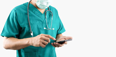 A doctor holding a smartphone on a white backgroundの写真素材