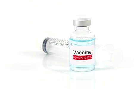 Antiviral vaccine bottle and medical Syringe on a white backgroundの写真素材
