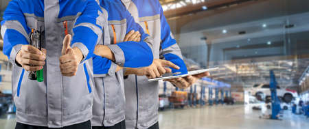 Auto mechanic team in the auto service center carの写真素材