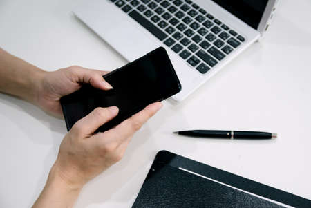 A woman sitting on the sofa Have back painの写真素材