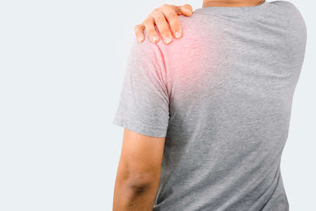 Man holding the shoulder Have back and shoulder painの写真素材
