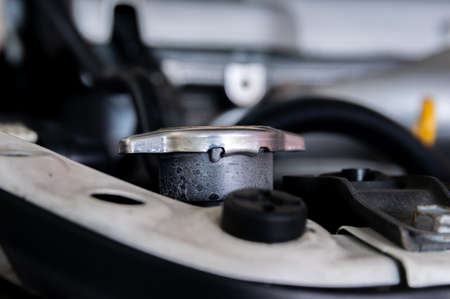 Car radiator cap maintenanceの写真素材