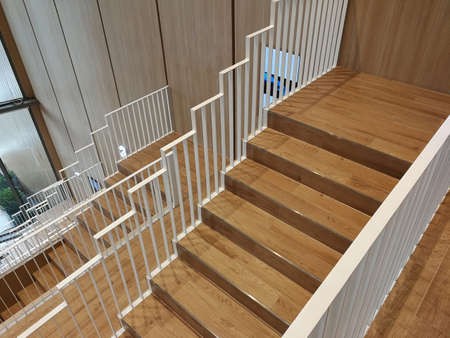 wooden stairs and white stair railings
