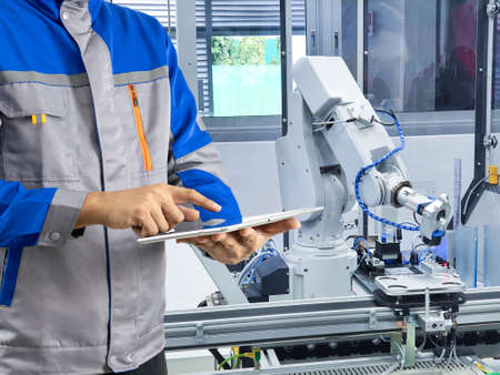 Control engineer for industrial robotic armsの写真素材