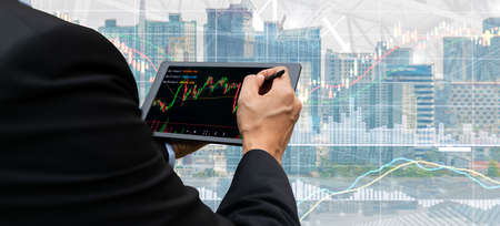 business people analyze financial graphs stock market concept with technologyの写真素材