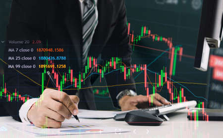 business people analyze financial graphs stock market concept with technologyの写真素材