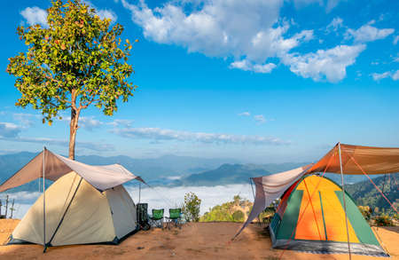 mountain camping travel tent and morning fogの写真素材