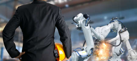 Factory industrial technology, robot control by engineers.の写真素材