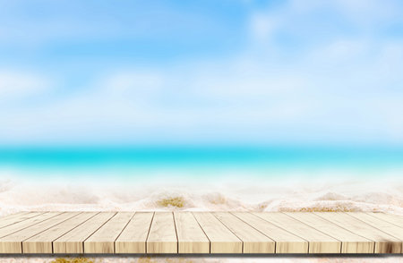 Top of wood balcony table with seascape and palm leaves, sea and sky at beachの写真素材