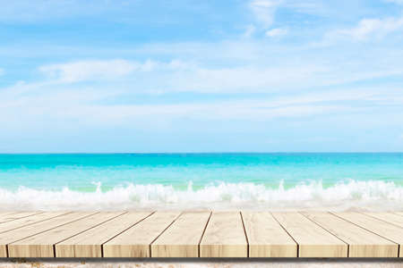 Top of wood balcony table with seascape and palm leaves, sea and sky at beachの写真素材