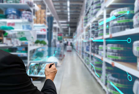 Innovative, inspecting the inventory of goods in the warehouse business with technologyの写真素材
