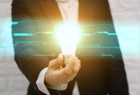Light bulb new ideas with innovative technology solution concepts hands of the businessman innovation financeの写真素材