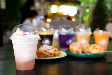 drink and bread in coffee shop blurred background