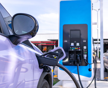 Electric cars parked for charging at power stations.の写真素材