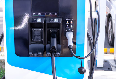 Electric cars parked for charging at power stations.の写真素材