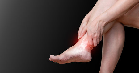 ankle osteoarthritis Joint pain, arthritis and ligaments on a black backgroundの写真素材