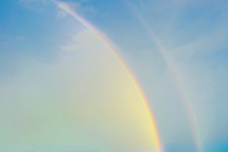 Rainbow, water, sky after rainの写真素材