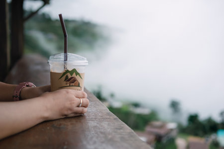 Coffee with a view, fog on the mountain, relaxation and travelの写真素材