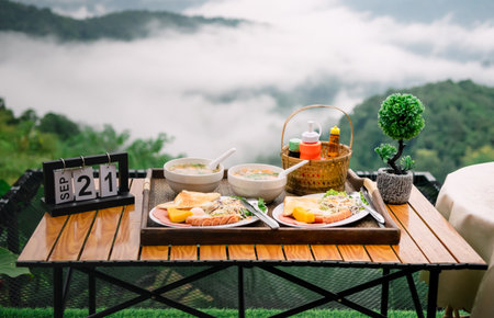 Breakfast, relax with a view of fog and mountains.の写真素材