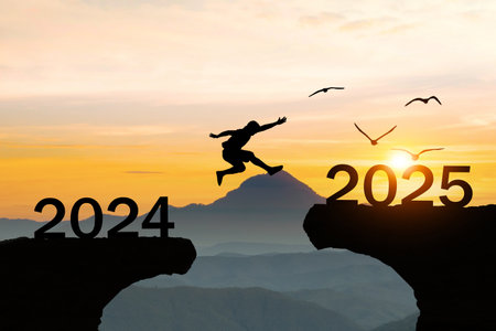 Silhouette Happy New Year 2025 People Jumping Over Cliffsの写真素材