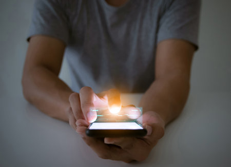 Man touching smartphone screen, communication technology conceptの写真素材