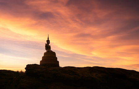 Buddha statue on the mountain in the morning lightの写真素材